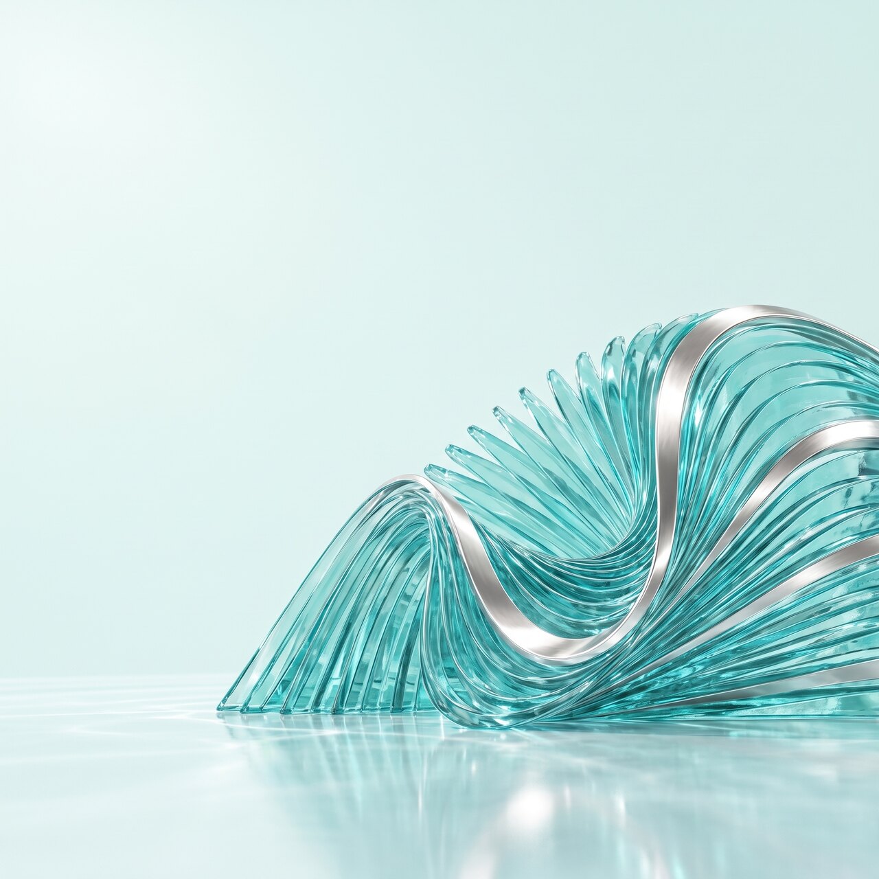 A material study photographed in bright daylight. A monumental pleated turquoise glass wave sits in the lower right of a square frame, its quarter turn bend and the polished pearl silver ribbon running through that bend both clearly readable, cropped by the right and bottom edges and reflected in a pearl floor. The upper left of the frame is empty pale mint.